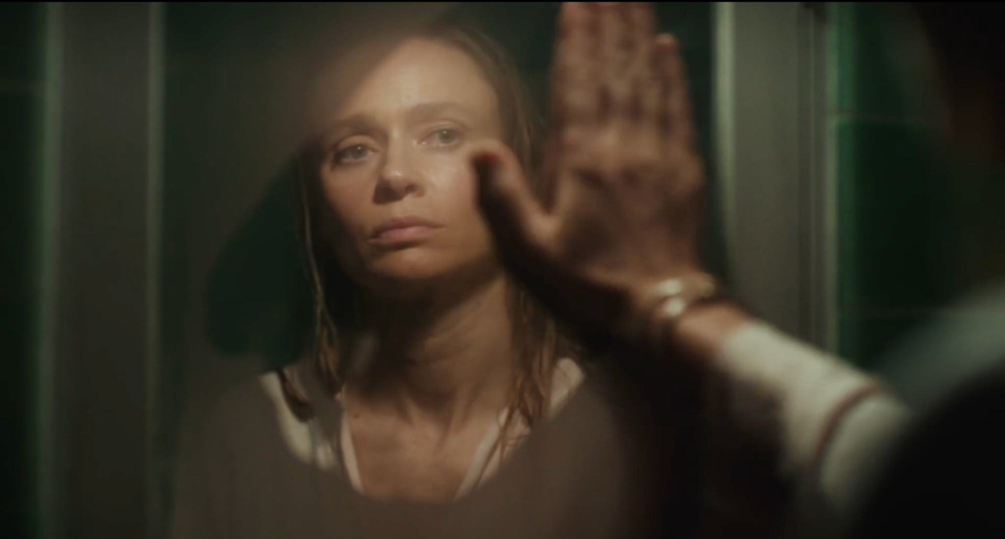 Sarah (Maeve Dermody) wipes steam from a bathroom mirror in Life Could Be A Dream