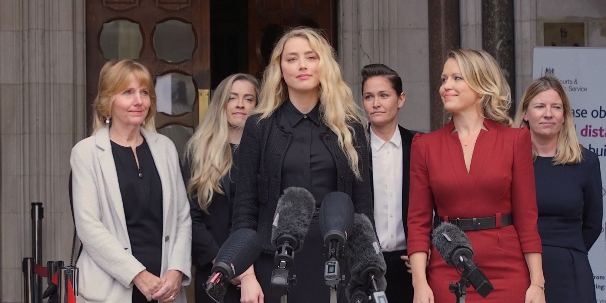 Amber Heard and lawyer Jennifer Robinson with legal team outside Royal Courts of Justice in Silenced documentary