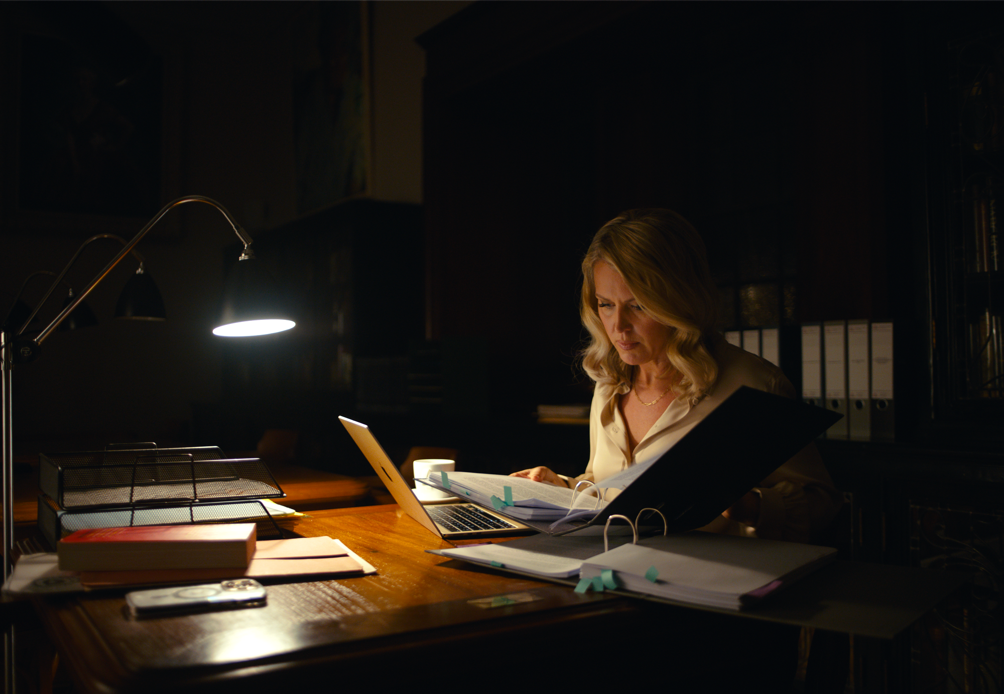 Australian human rights lawyer Jennifer Robinson reviews case files at her desk in documentary Silenced