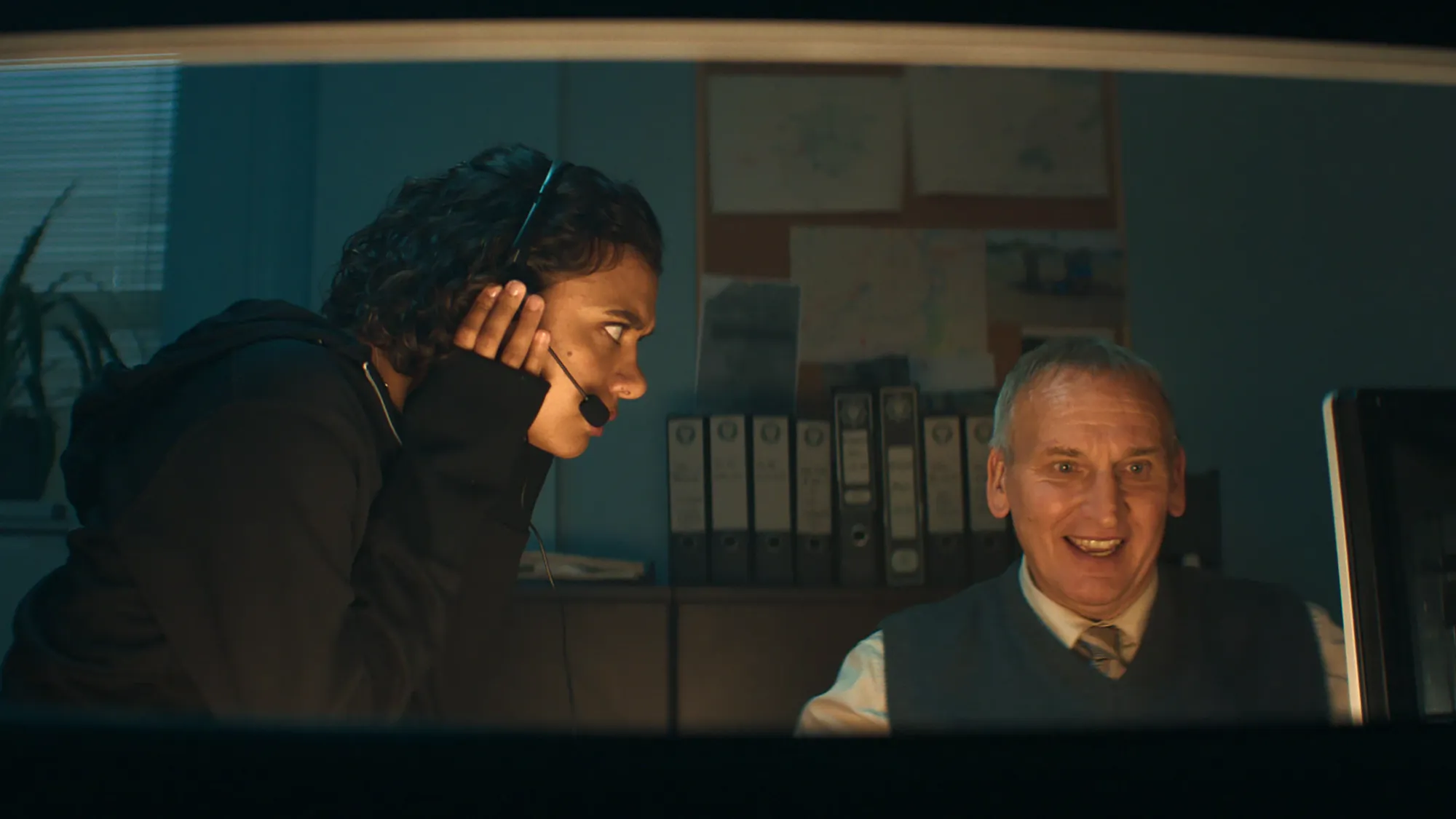 Madeleine Madden and Christopher Eccleston in a police station scene from Chasing Millions